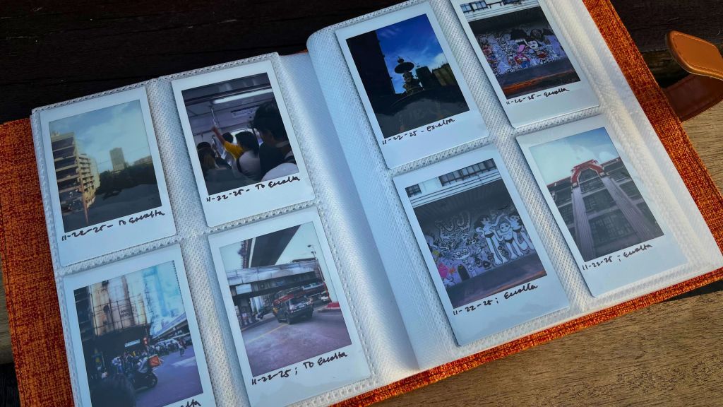 Instax Mini instant film photos stored inside a small photo album, printed using the Instax Mini Evo